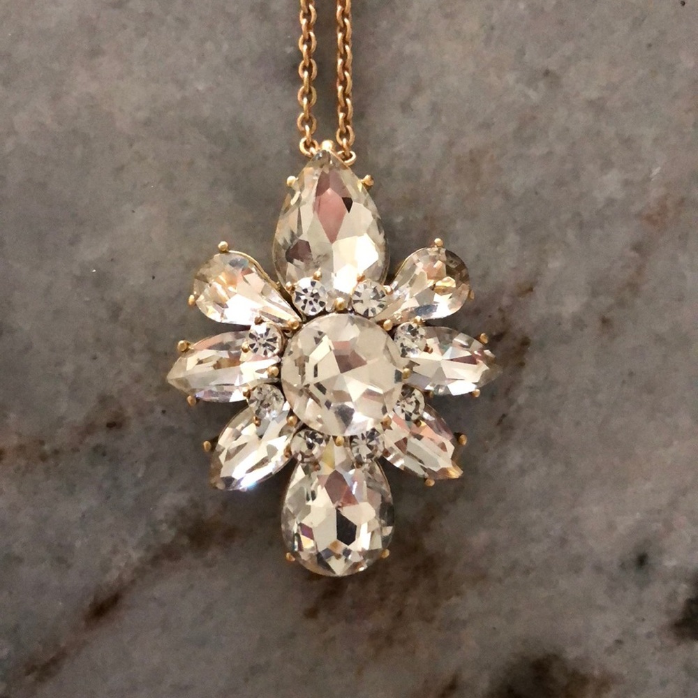 Long gold necklace with crystal design